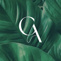 a green leaf with the letter a on it